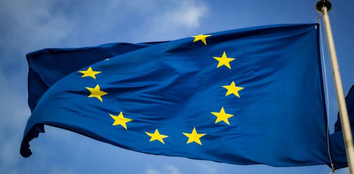 EU flag waving against a blue sky