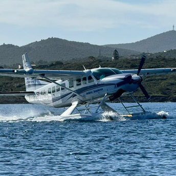 Hellenic Seaplanes aircraft taking off from the water
