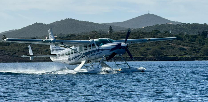 Hellenic Seaplanes aircraft taking off from the water