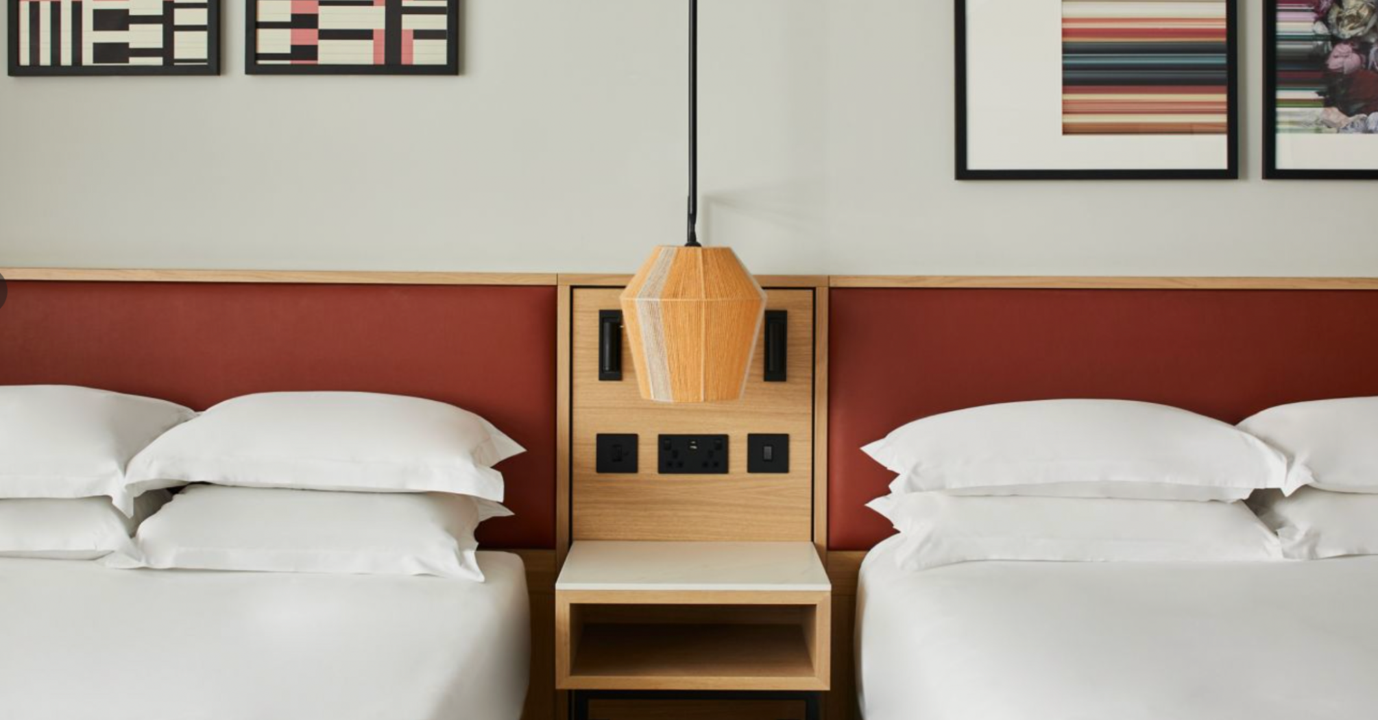 Twin hotel room with modern wall art at Manchester Marriott Piccadilly