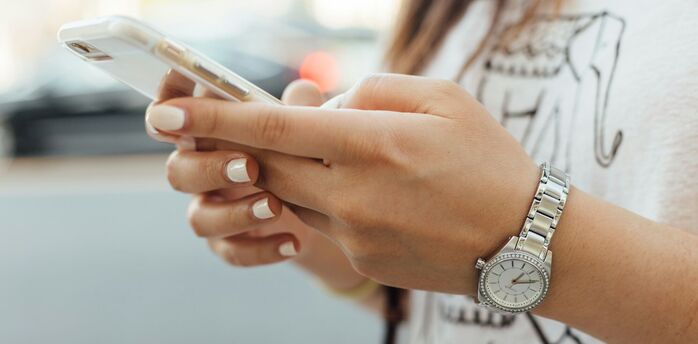 Traveller using a smartphone before posting online