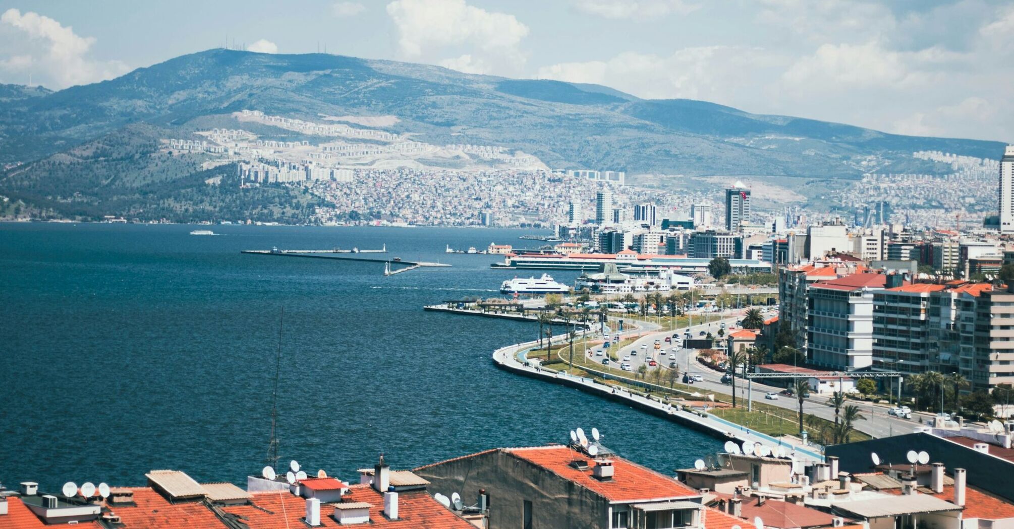 Izmir coastline with mountains and city buildings