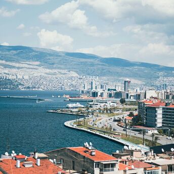 Izmir coastline with mountains and city buildings