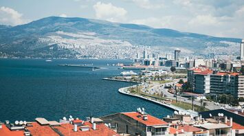 Izmir coastline with mountains and city buildings