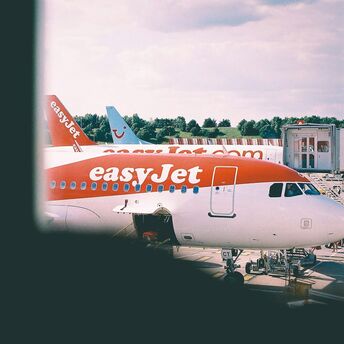 easyJet aircraft parked at an airport terminal