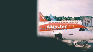 easyJet aircraft parked at an airport terminal
