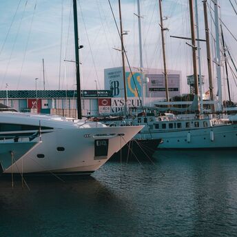 Yachts moored at Barcelona marina near the waterfront