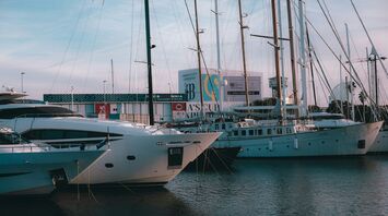 Yachts moored at Barcelona marina near the waterfront