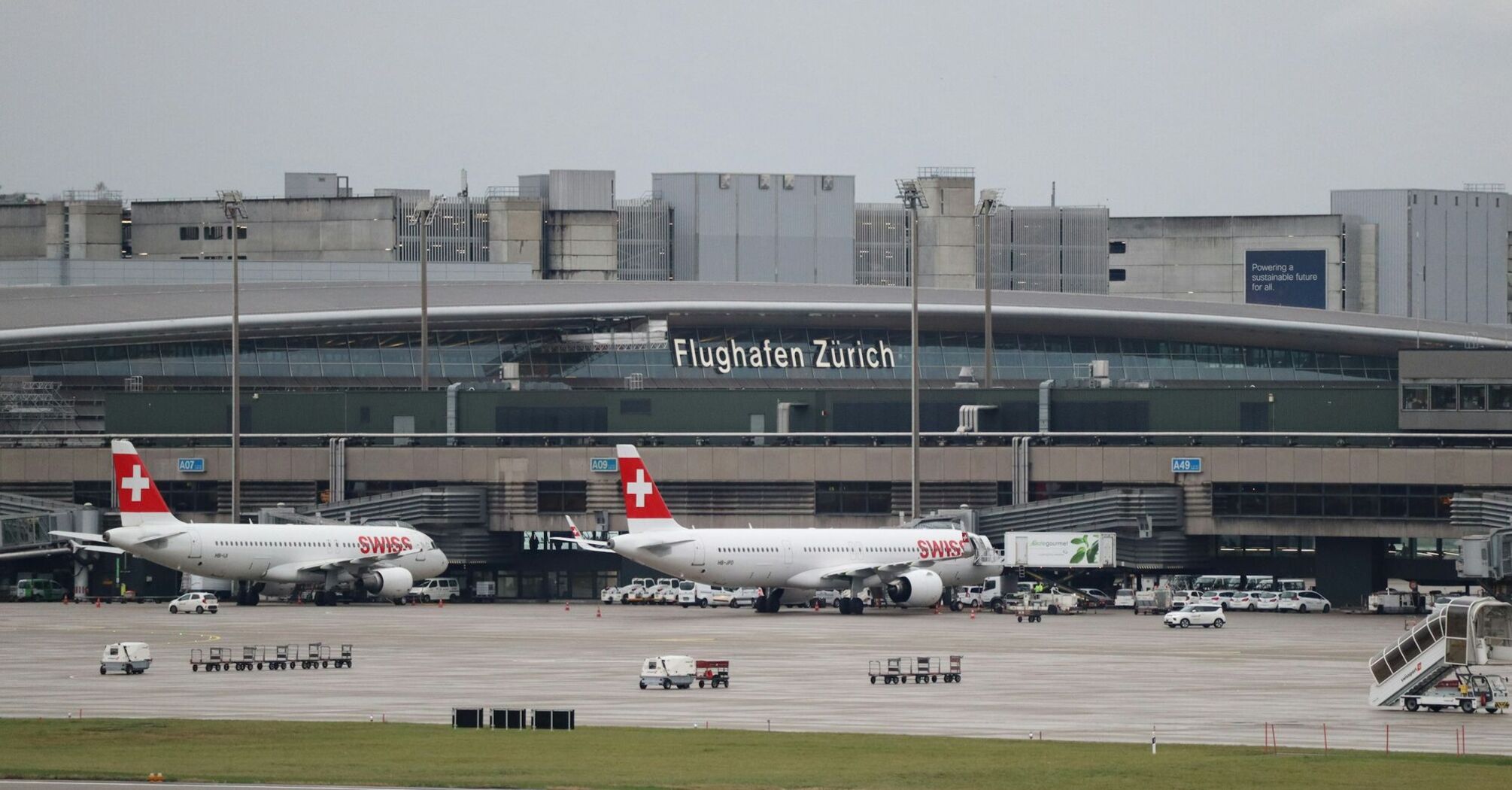 Zurich Airport terminal with SWISS aircraft