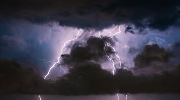 Lightning strikes during a dark thunderstorm