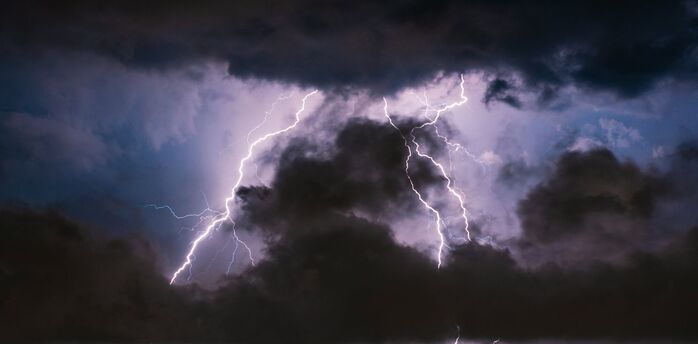 Lightning strikes during a dark thunderstorm