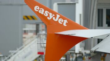 easyJet aircraft tail at an airport gate