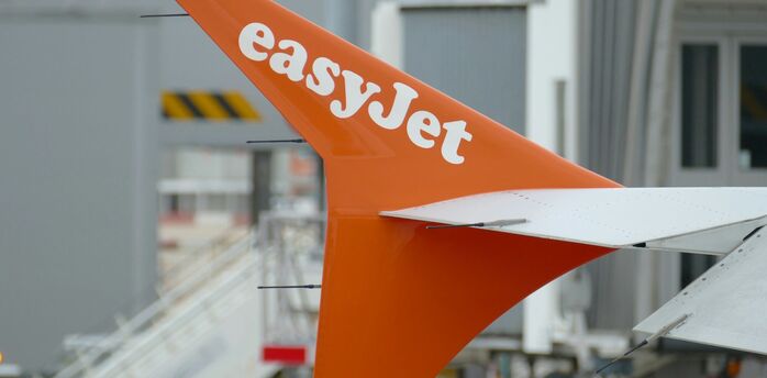 easyJet aircraft tail at an airport gate
