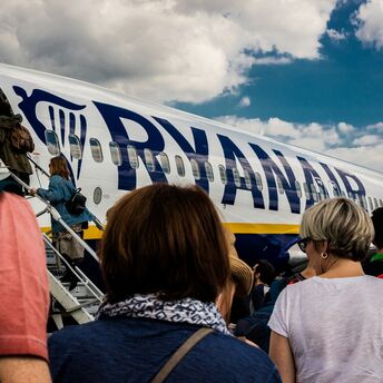 Passengers boarding a Ryanair aircraft on the tarmac