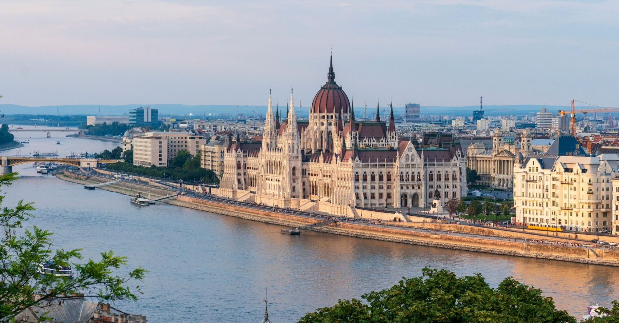 Budapest Parliament beside the Danube at sunset