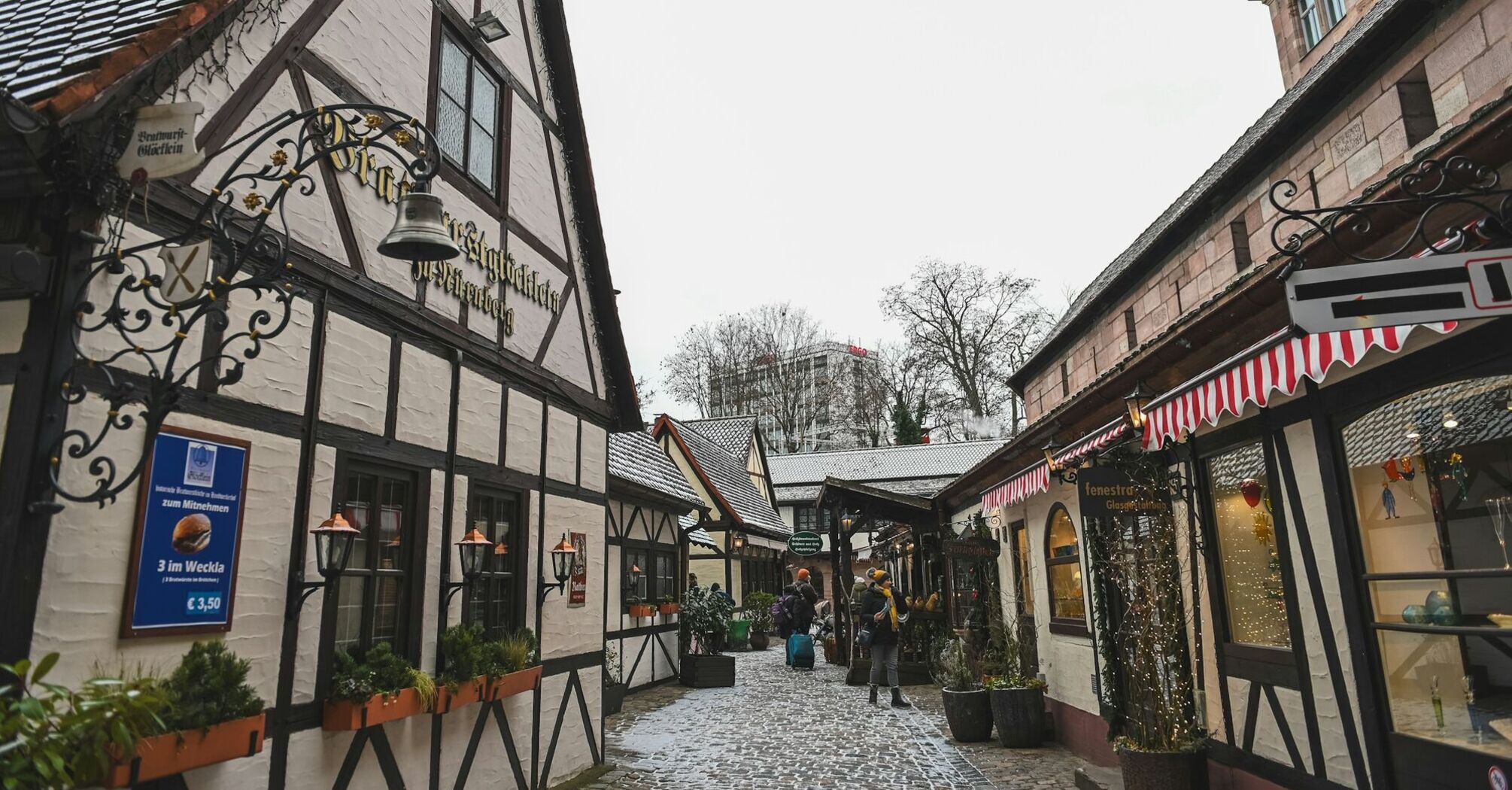 Snow-dusted half-timbered street in Nuremberg old town