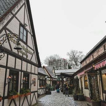 Snow-dusted half-timbered street in Nuremberg old town