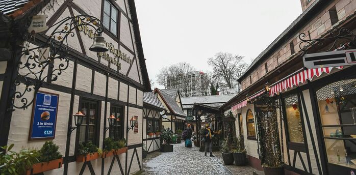 Snow-dusted half-timbered street in Nuremberg old town