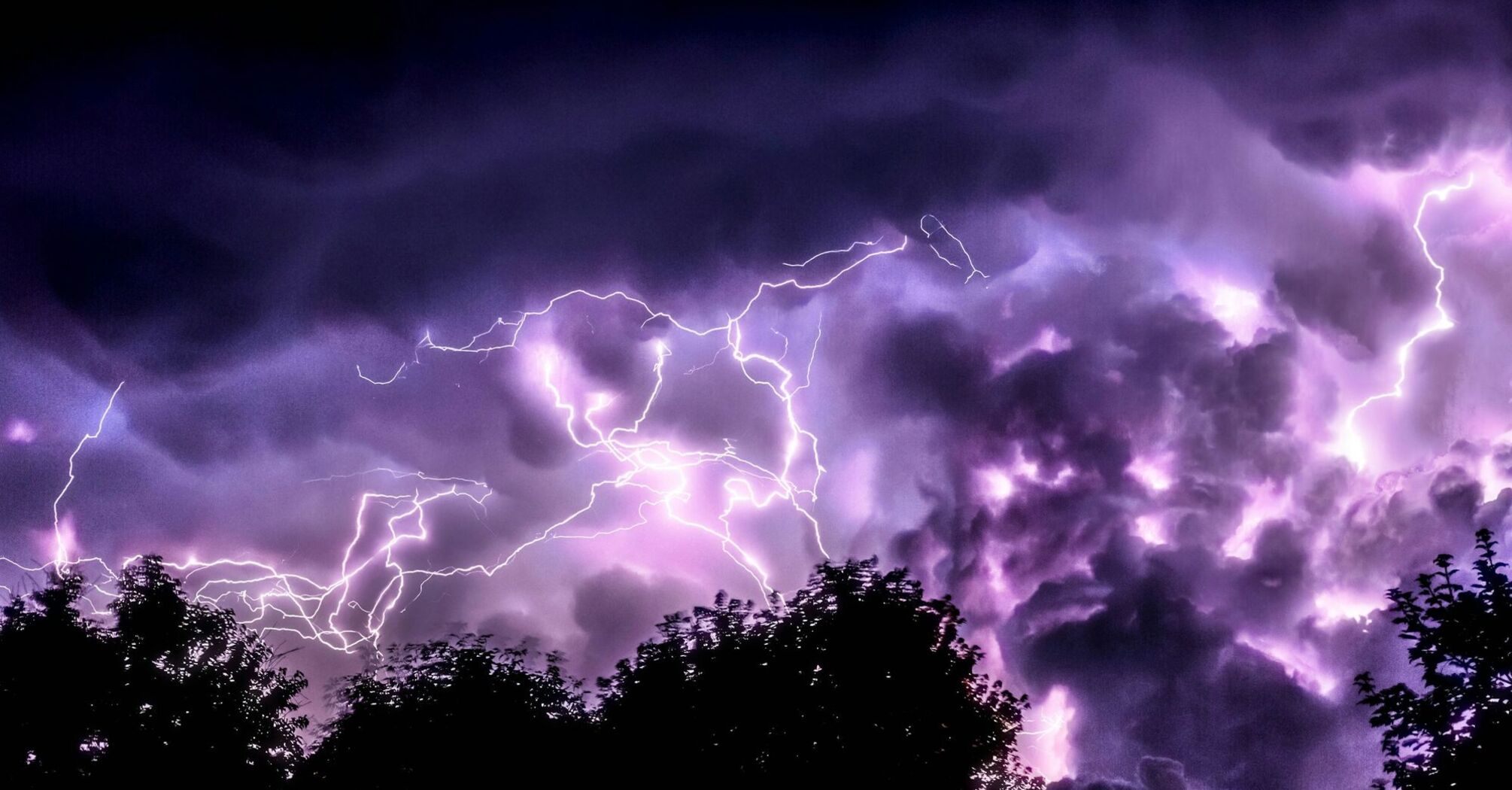 Lightning storm over dark clouds