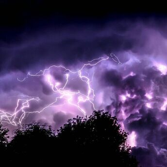 Lightning storm over dark clouds