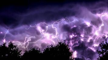 Lightning storm over dark clouds