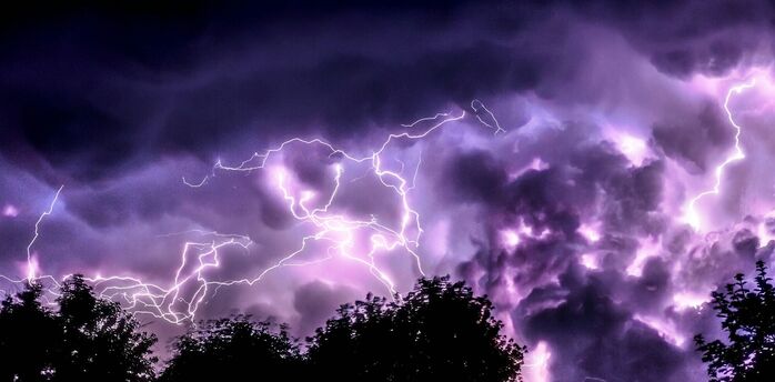 Lightning storm over dark clouds