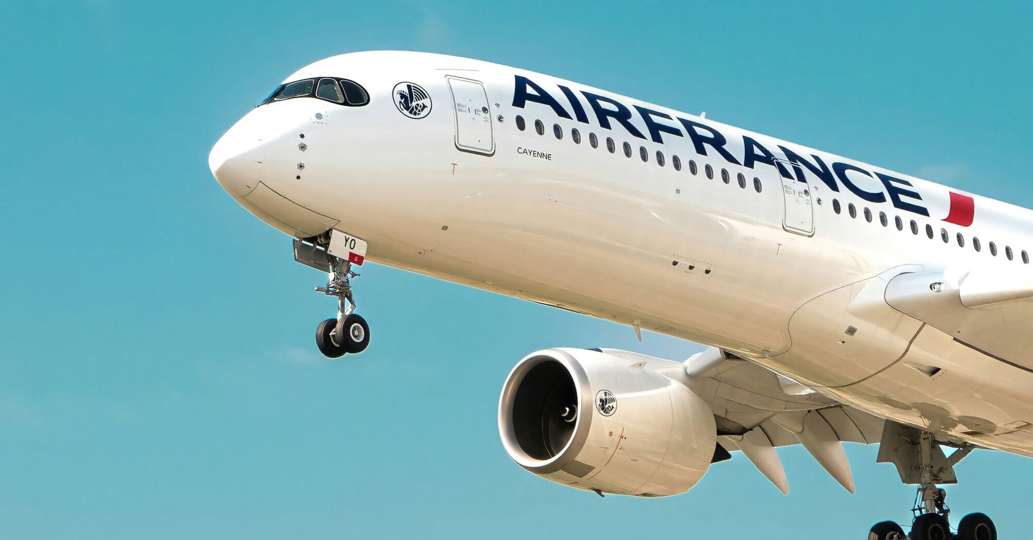 Air France aircraft coming in to land against a blue sky