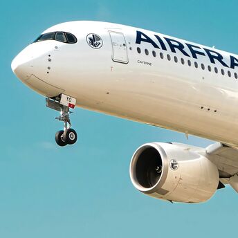 Air France aircraft coming in to land against a blue sky