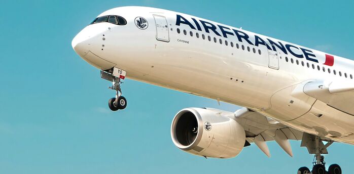 Air France aircraft coming in to land against a blue sky