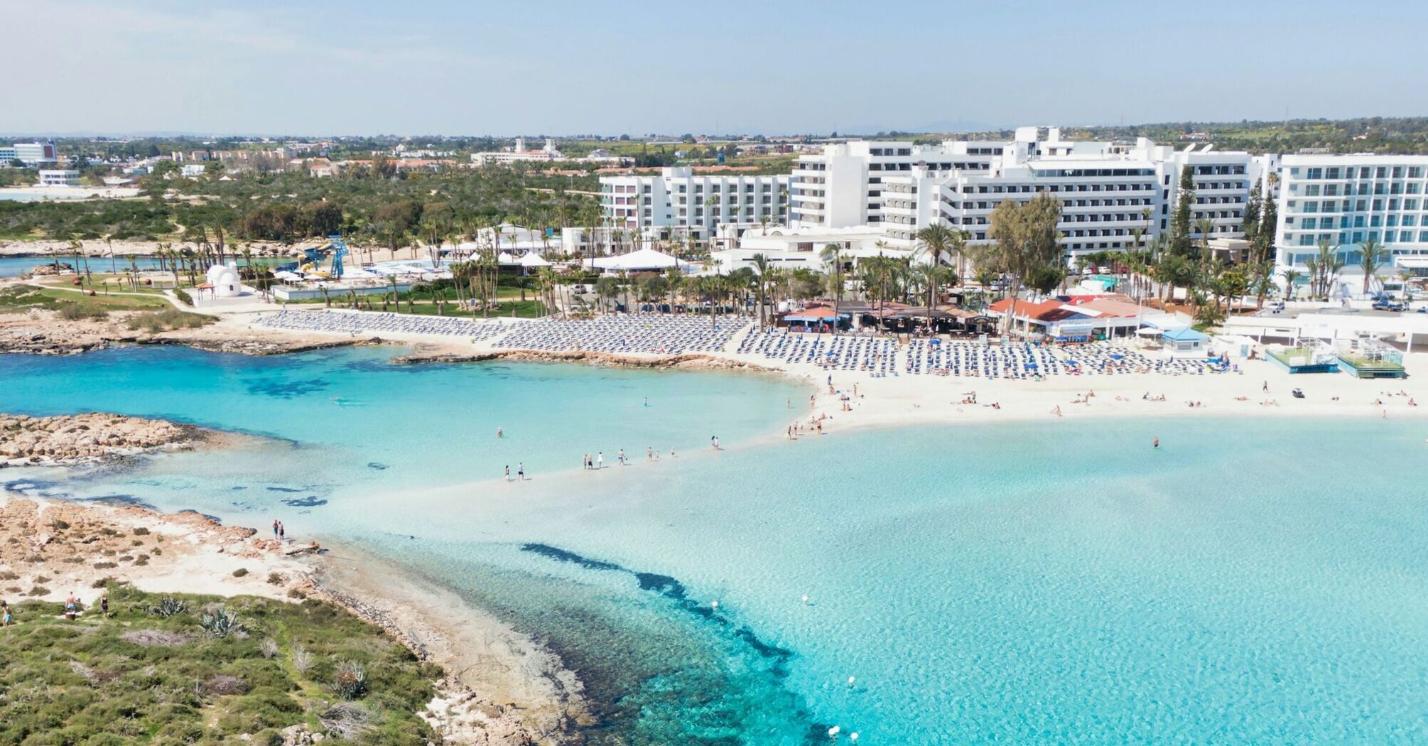 Aerial view of a sandy beach and turquoise sea in Cyprus