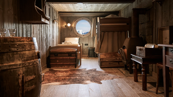 1896 Cabin aboard MS Fridtjof Nansen with wooden explorer-style interiors