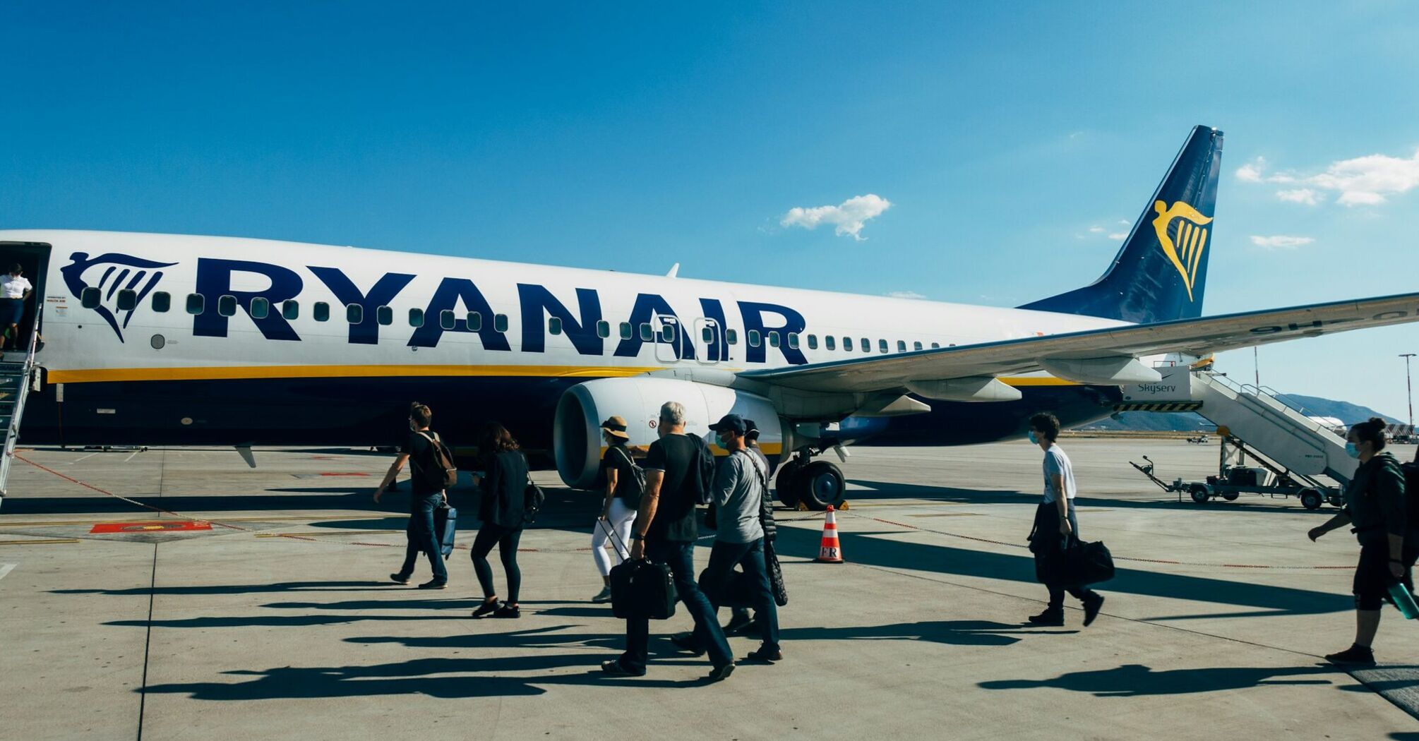 Passengers boarding a Ryanair aircraft on the tarmac