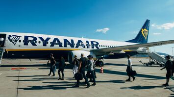 Passengers boarding a Ryanair aircraft on the tarmac