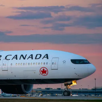 Air Canada aircraft on the runway at sunset