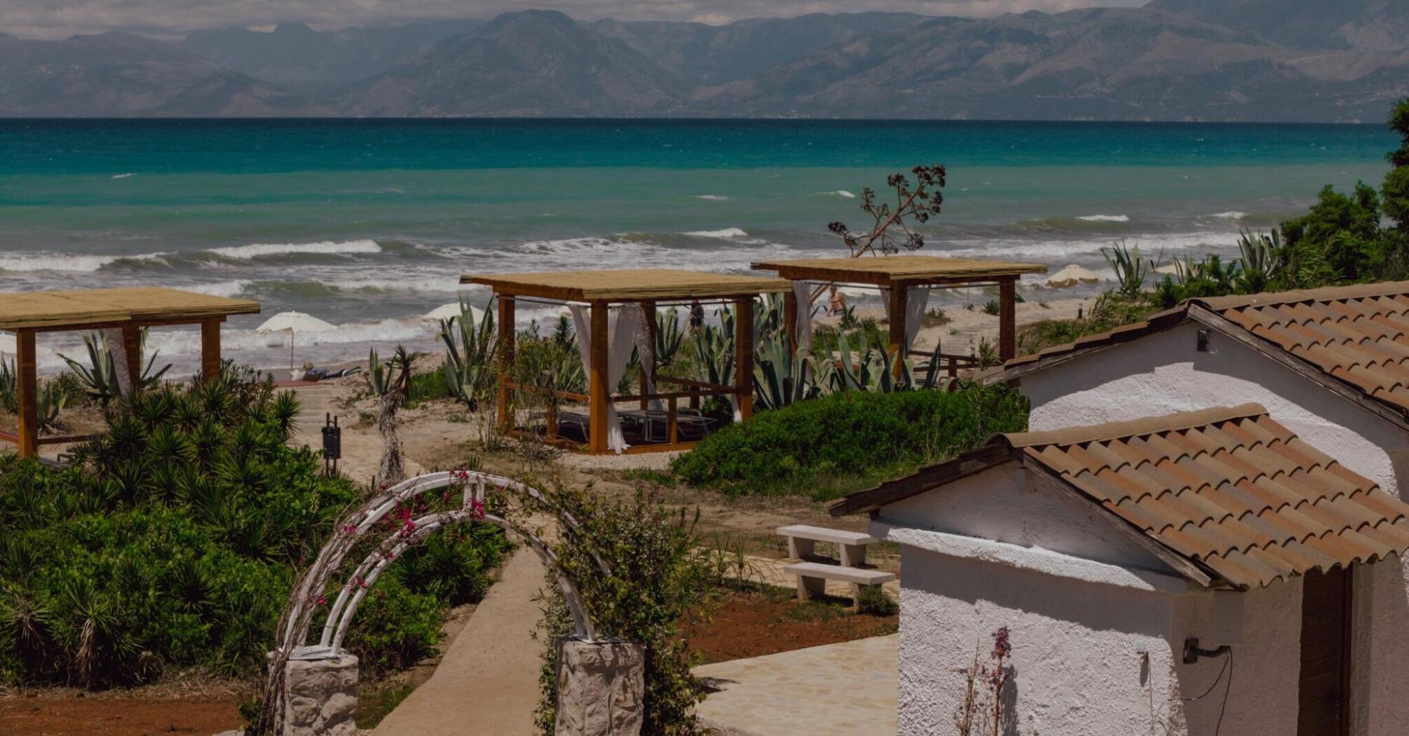 Beachfront area with cabanas on Corfu’s northern coast