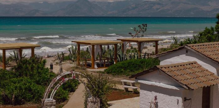 Beachfront area with cabanas on Corfu’s northern coast