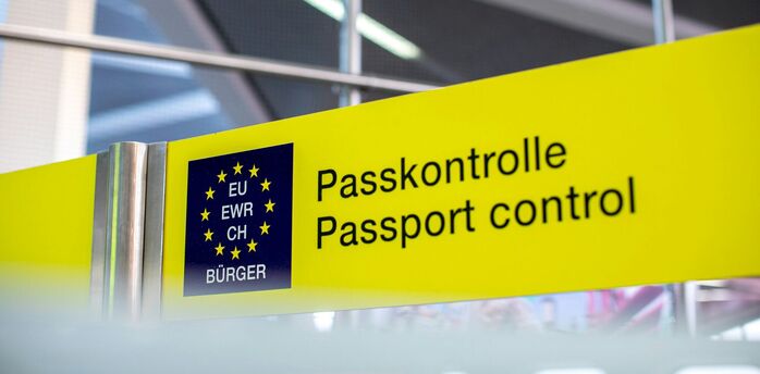 Passport control sign at an EU border checkpoint