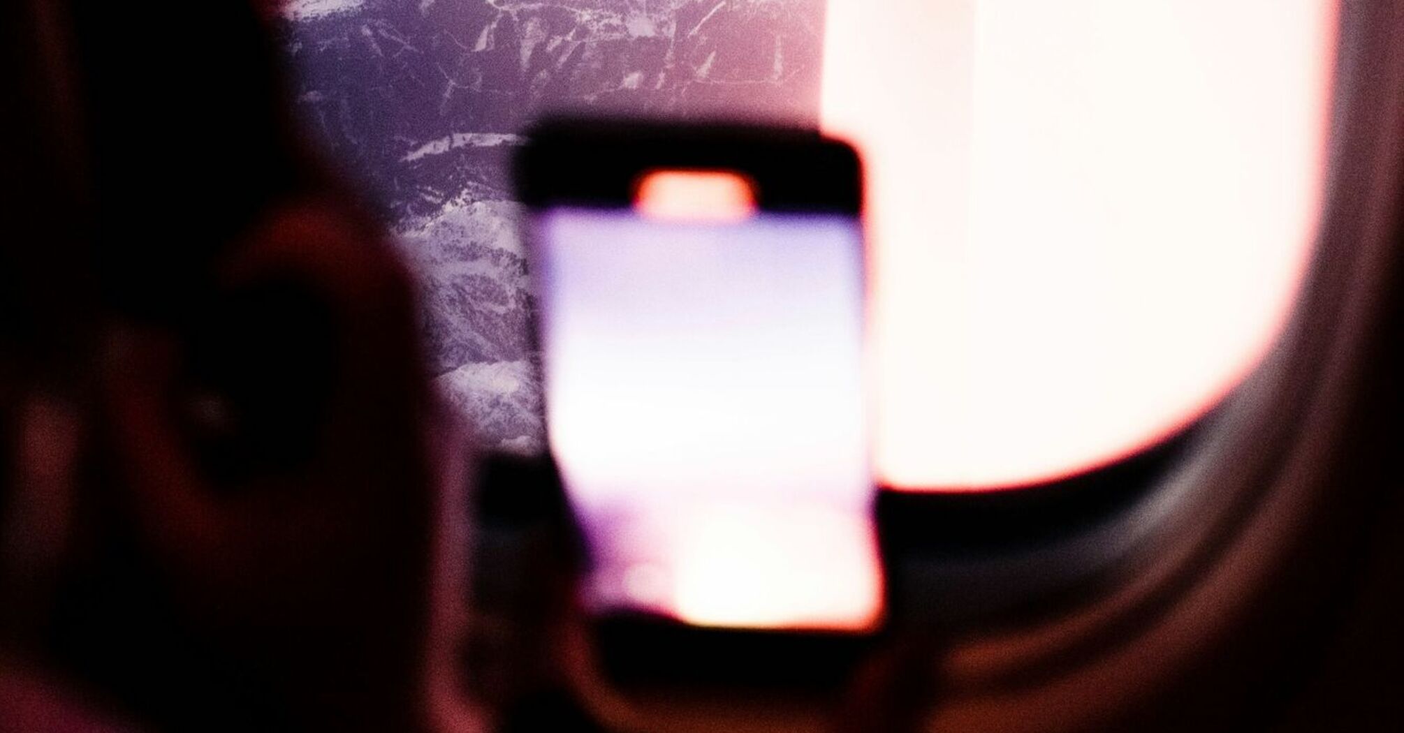 Passenger using a smartphone during a flight