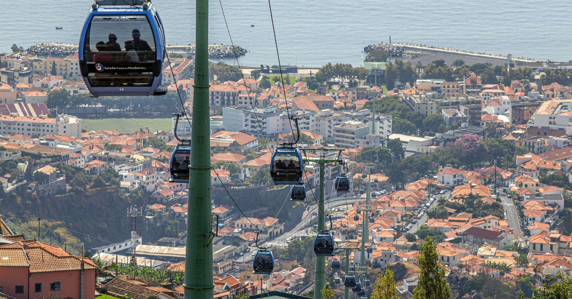 Cable car above a Portuguese town and coastline