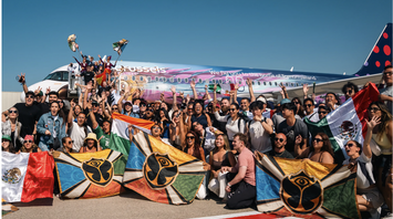 Tomorrowland travellers arrive on a Brussels Airlines Party Flight