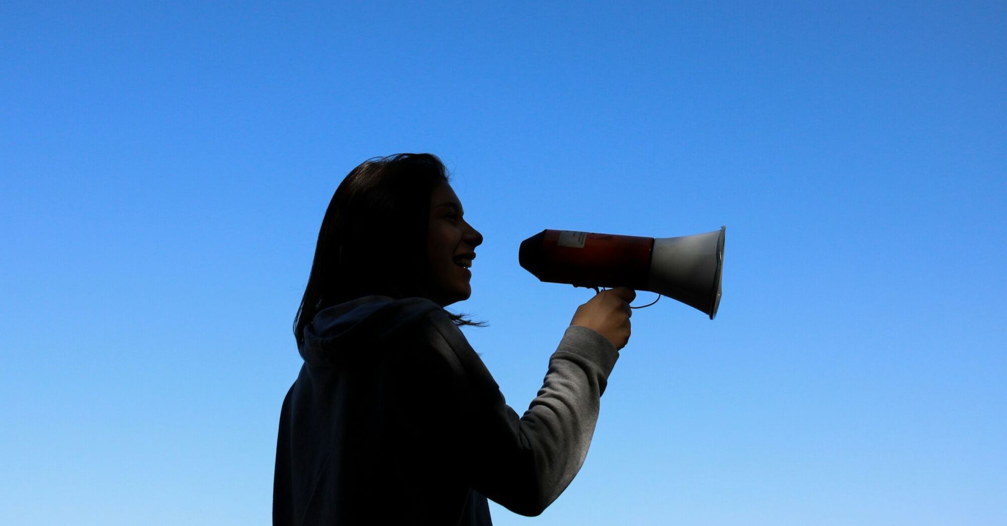 Woman speaking through a megaphone