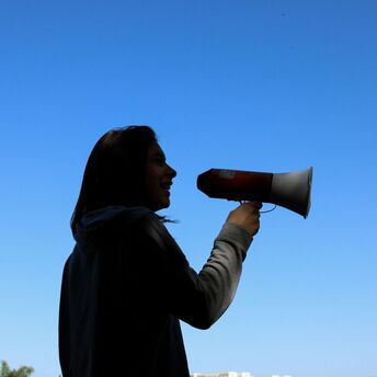 Woman speaking through a megaphone