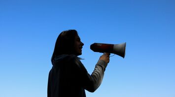 Woman speaking through a megaphone