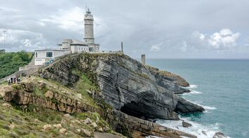 Lighthouse on the rocky Santander coastline
