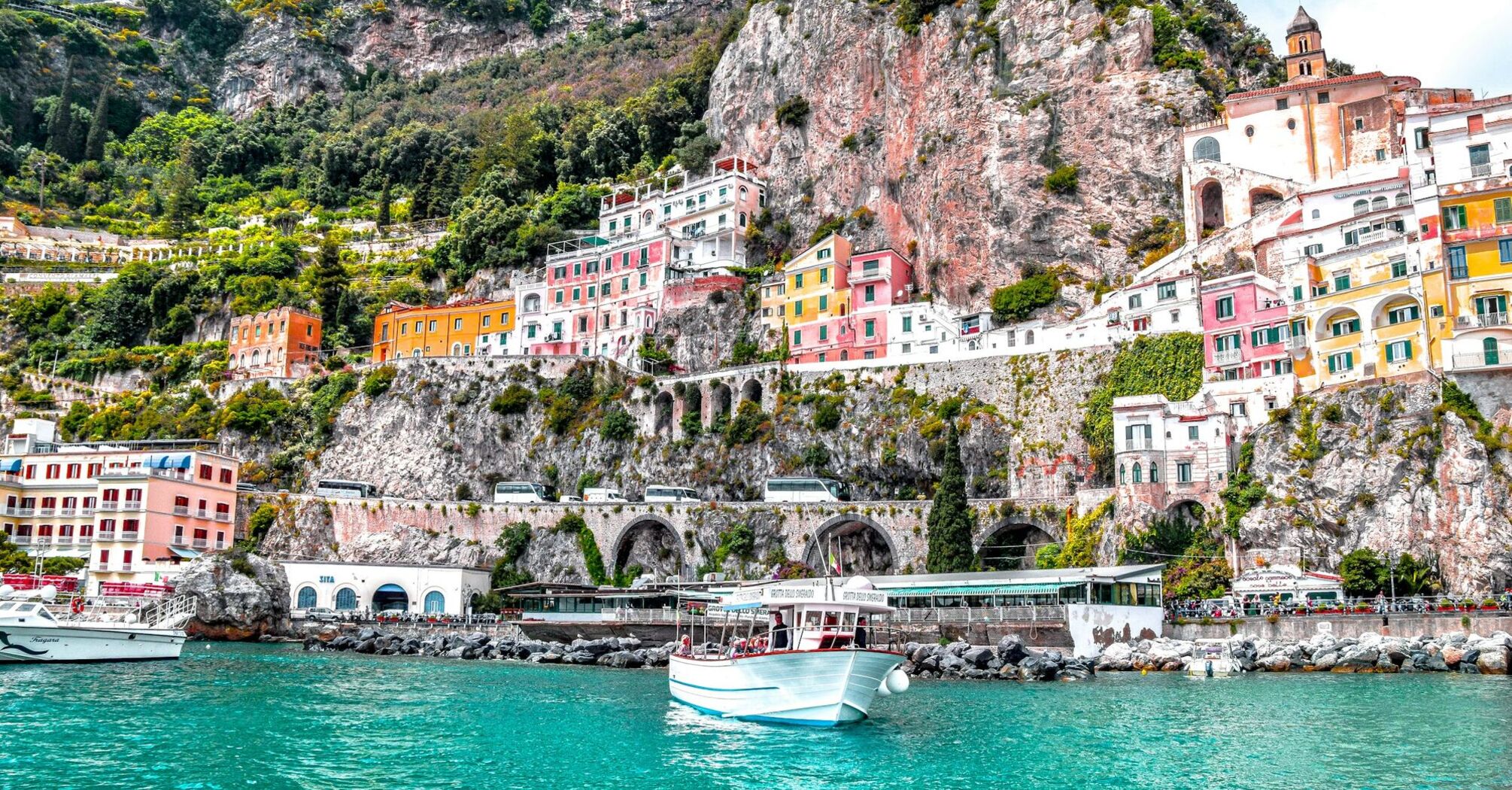 Colourful Amalfi Coast buildings beneath steep cliffs