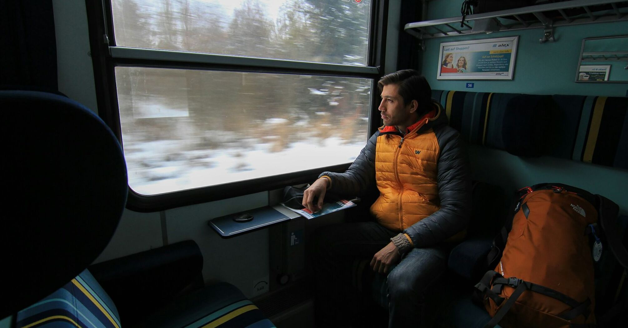 Passenger looking through a European train window