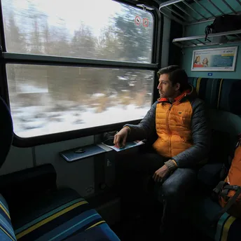 Passenger looking through a European train window