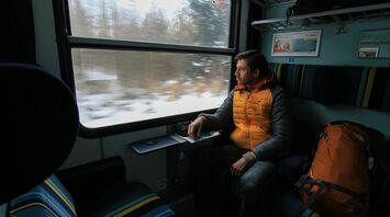Passenger looking through a European train window