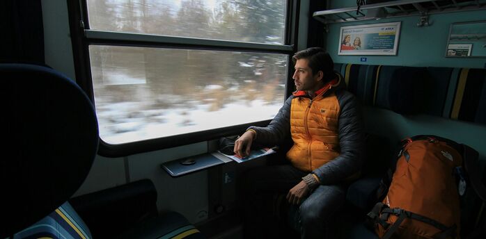 Passenger looking through a European train window