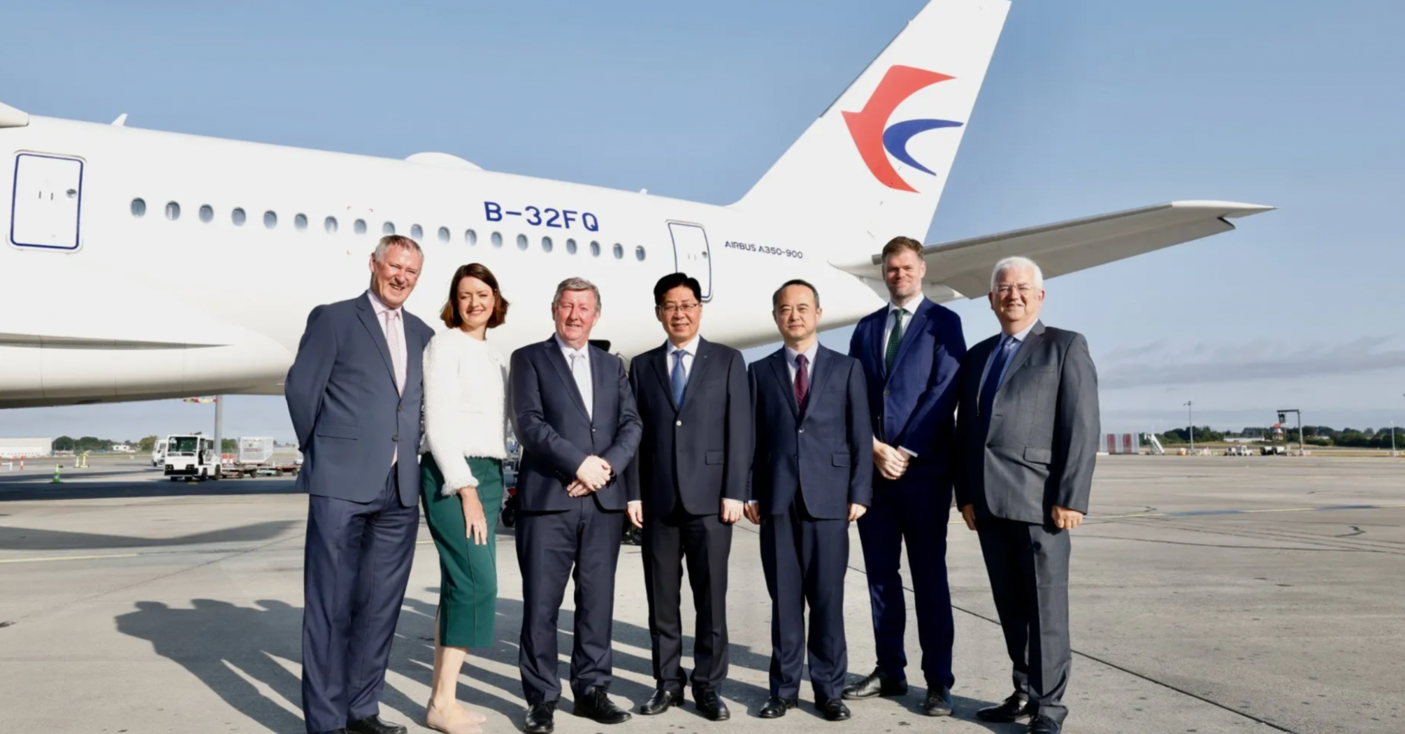 Officials beside a China Eastern Airbus A350